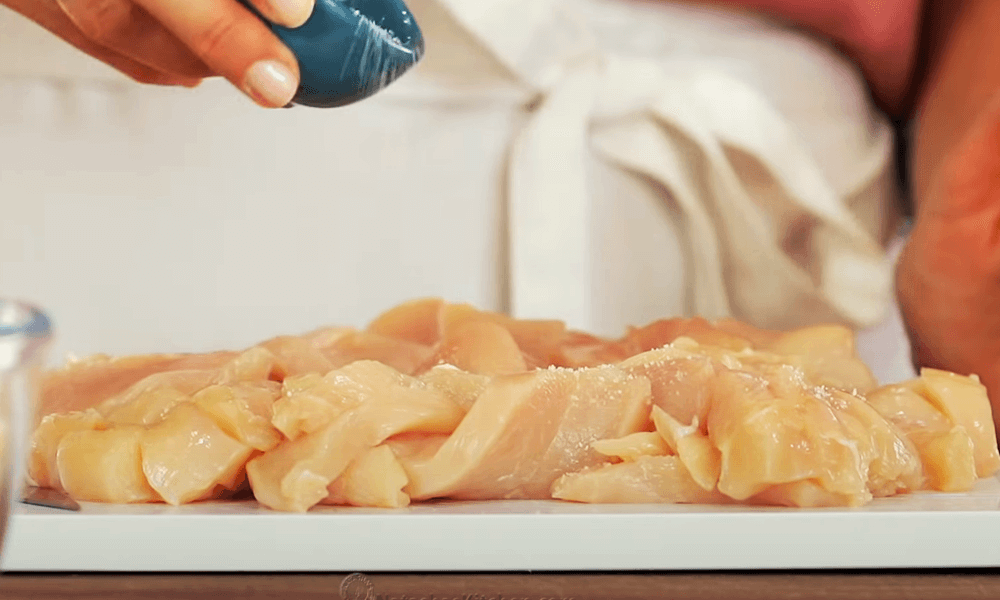 Mixing Chicken Breasts with salt and pepper