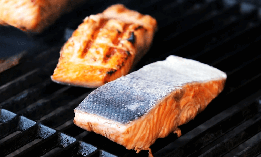 place the salmon into the hot grill other side